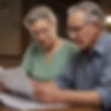 An elderly couple reviewing insurance documents together