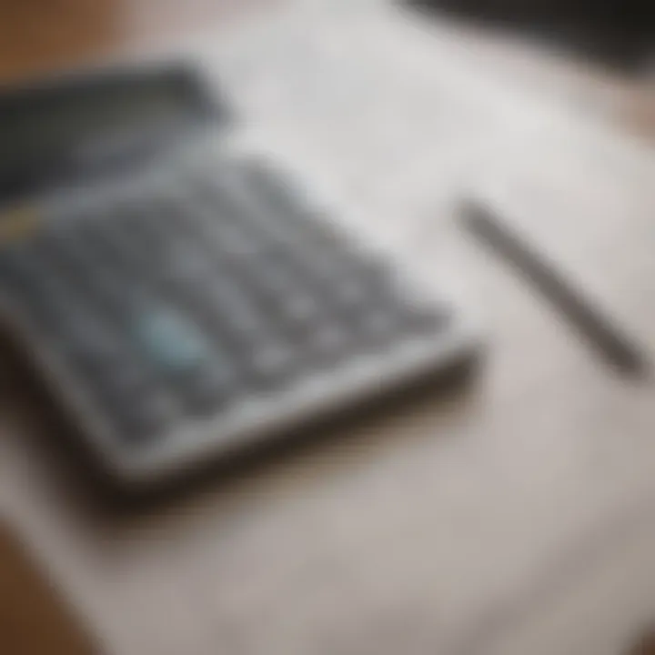 A calculator placed alongside mortgage documents